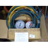 A set of car air conditioning hoses & gauges (one gauge has glass missing)