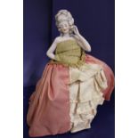 A collectable ceramic half doll figures