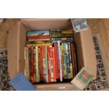 A box full of vintage children's annuals etc