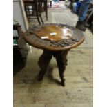 A hand carved wooden side table