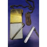 A vintage brass cased note pad & pencil & MOP handled fruit knife