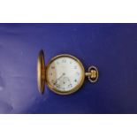 A vintage gold plated Dennison pocket watch (needs attn)