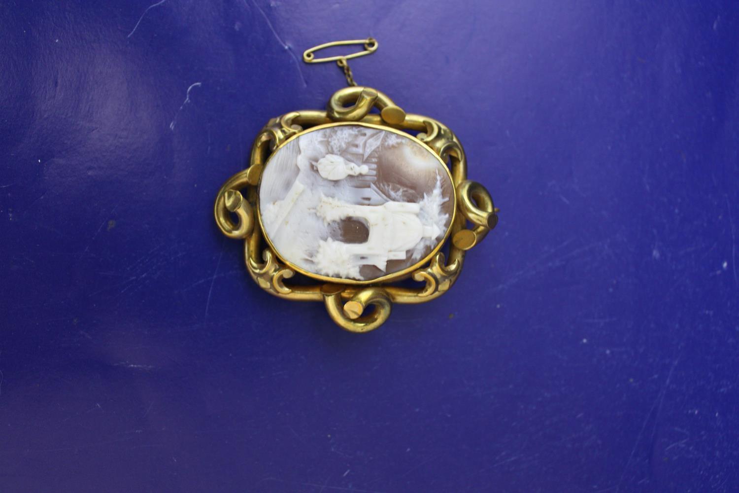 A antique gold tone cameo brooch