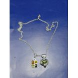 A Sterling silver & amber necklace with two amber pendants