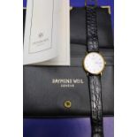 A boxed with papers Raymond Weil watch (not working needs battery)