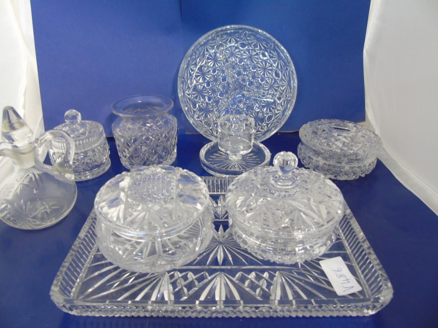 A selection of glass dressing table items