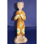 A antique partly glazed Chinese figure playing flute h33cm