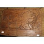 A light teak table with carved elephant relief decoration to the top. h42, w60cm unable to post