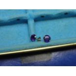 A pair of 9ct gold & amyethst stud earrings