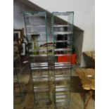 A pair of Green Apple heavy glass CD racks W17, H97, D18cm unable to post