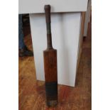 A antique cricket bat by Gunn & Moore, with a hallmarked silver shield on back