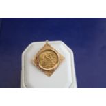 A 22ct gold 1910 half sovereign in a 9ct gold mount 7.4 grams total
