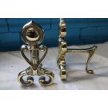 A pair of Art Nouveau period solid brass fire dogs