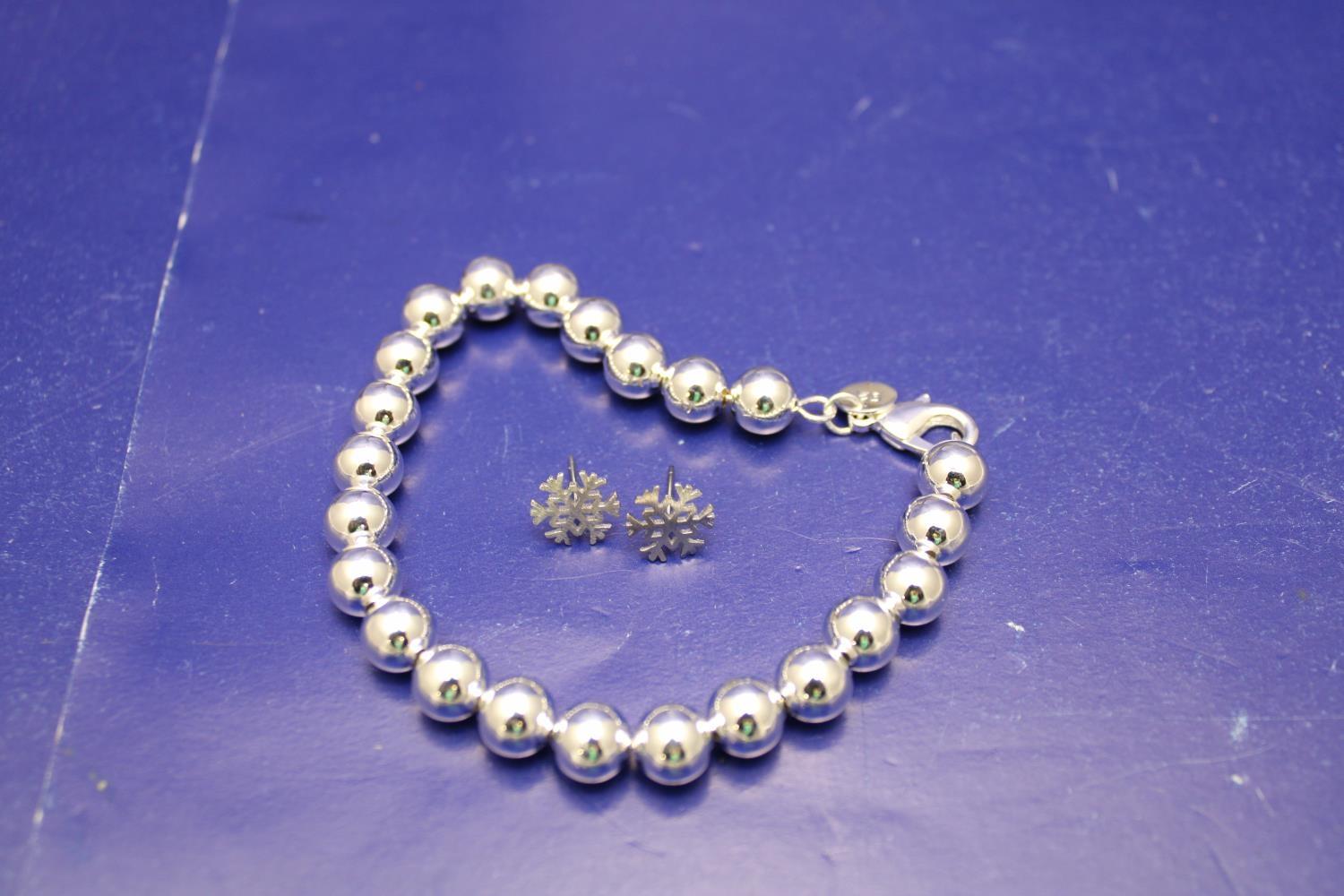 A 925 silver bracelet and pair of new silver earrings