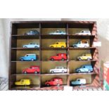 A selection of Vanguards die-cast models in a display case