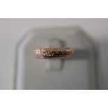 A 9ct rose gold patterned ring size P
