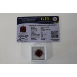 A Ruby gemstone with certificate