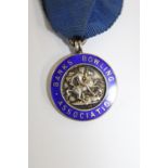A vintage hallmarked silver & enamel bowling medal