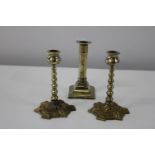Three antique brass candlesticks pair 15cm tall