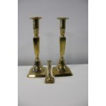 Two matching antique brass candlesticks & one other 25cm