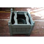 A square wooden garden planter unable to post