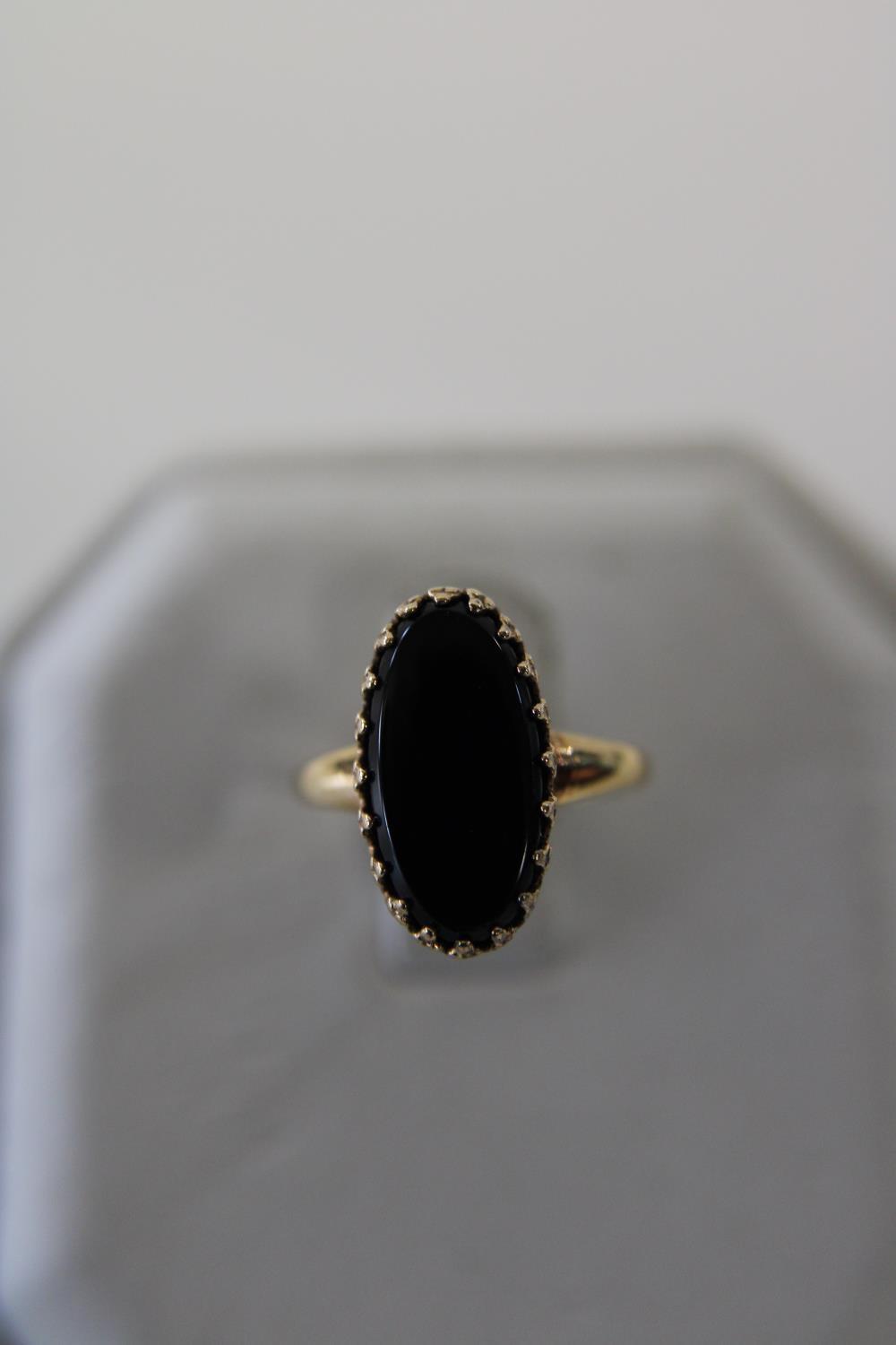 A 10ct gold & onyx ring size E