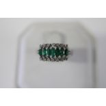 A vintage 14ct white gold ring with diamonds & emerald decoration 4 grams