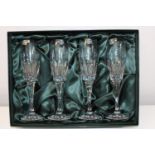 A boxed set of four quality Thomas Webb lead crystal champagne flutes