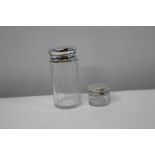 Two hallamrked silver faceted glass bottles