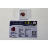 A Ruby gemstone with certificate