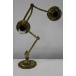 An antique Victorian brass adjustable double candle holder