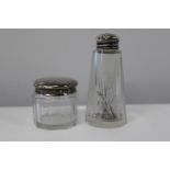 Two hallmarked silver topped faceted glass bottles