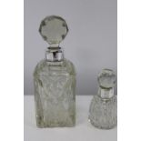 Two hallmarked silver collared glass scent bottles