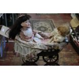 A vintage child's pram & two bisque headed dolls 52cm H x 68 L unable to post