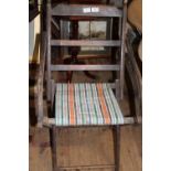 An antique campaign style wooden folding chair unable to post