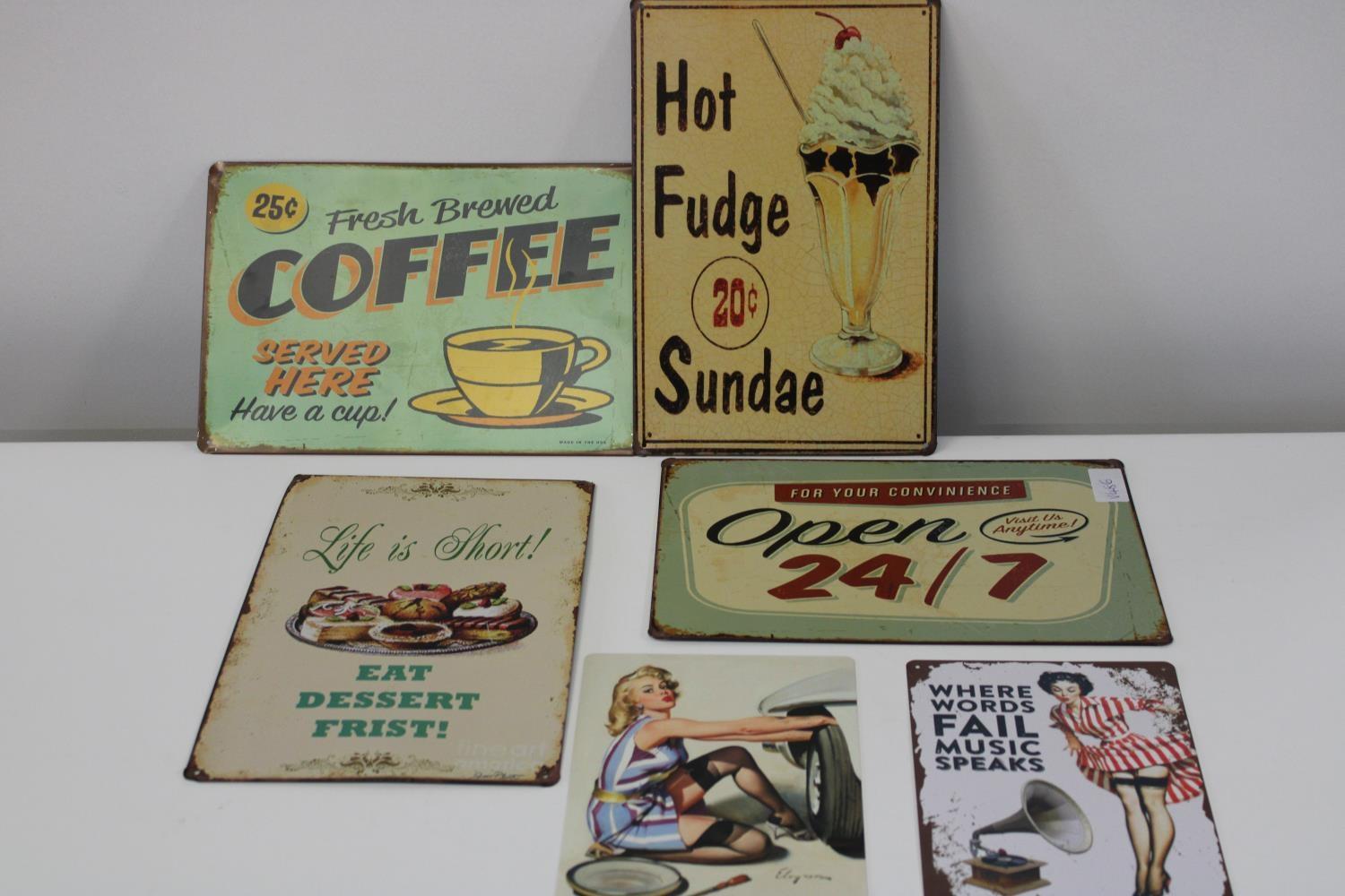 A selection of vintage style metal signs