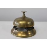 A brass counter bell