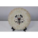 A quality soapstone plate with inlay decoration