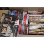 A box full of DVD's & CD's