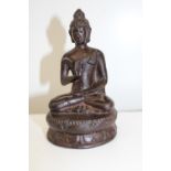 A Chinese Ming style seated bronze Budha figure h13cm