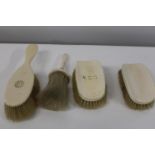 A selection of antique ivory handled brushes
