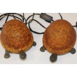 A pair of unusual tortoise form bedside lamps