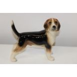 A ceramic dog figurine approx 14cm x 14cm