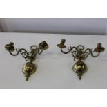 Two heavy solid brass wall mounted candle holders