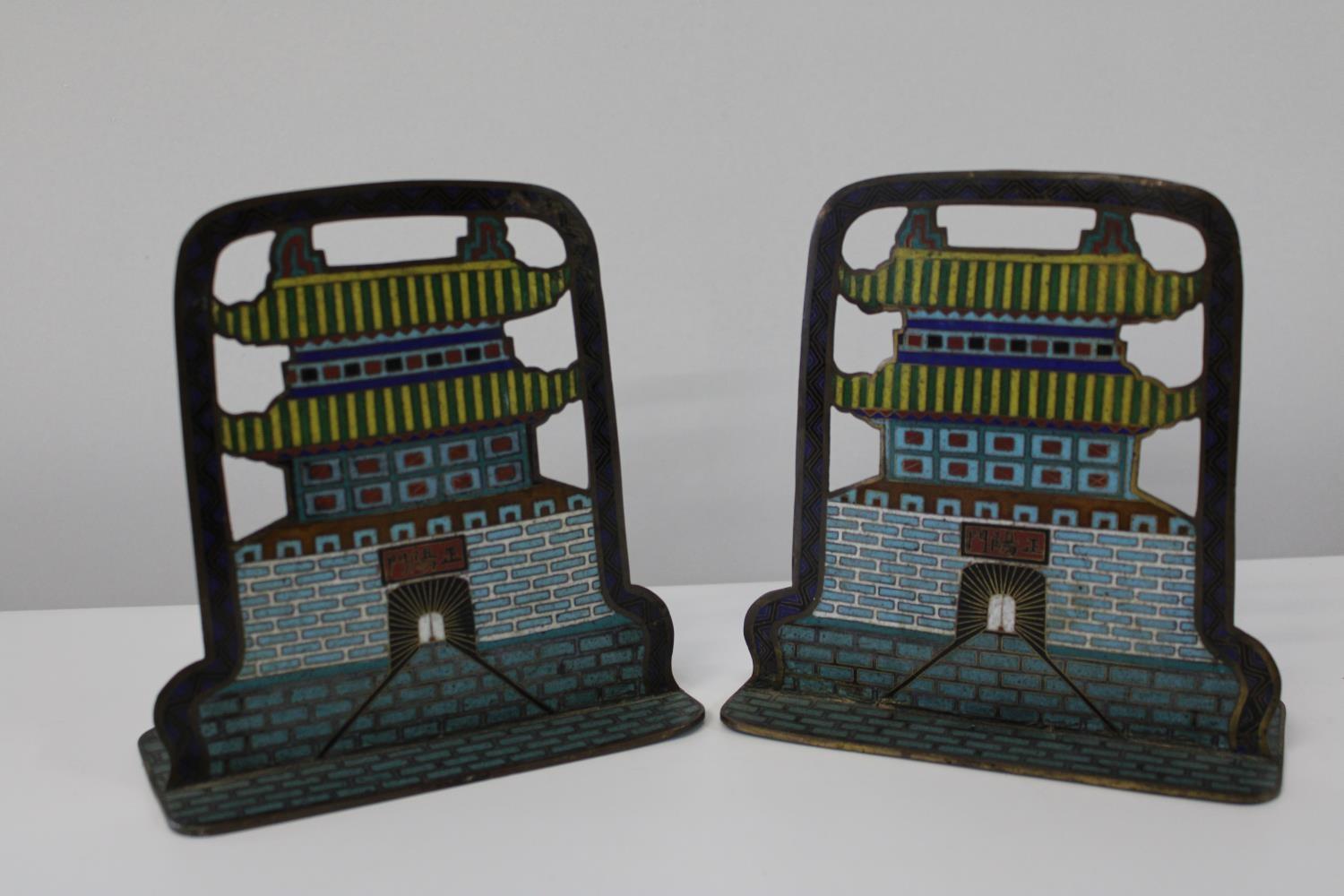 Two antique Chinese cloisonne book ends in the form of pagodas, signed to the center h17cm