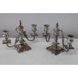 A quality pair of silver of copper candlesticks