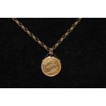 A Victorian 1890 full gold sovereign in a 9ct gold mount on & 9ct gold chain total weight 17 grams