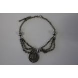 A Ladies Albertine chain with silver coin decoration