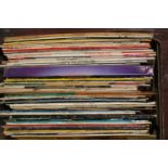 A boxed of mixed genre LP records