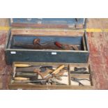 A vintage carpenters tool box and contents